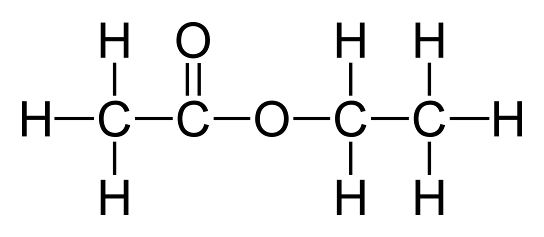 Displayed formula of ethyl ethanoate, CH₃COOC₂H₅, showing the ester linkage (−COO−): a C=O double bond next to an −O− that joins to the ethyl group from the alcohol